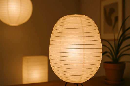 Glowing paper lanterns softly illuminating a minimalist room with warm, diffused light and natural textures.